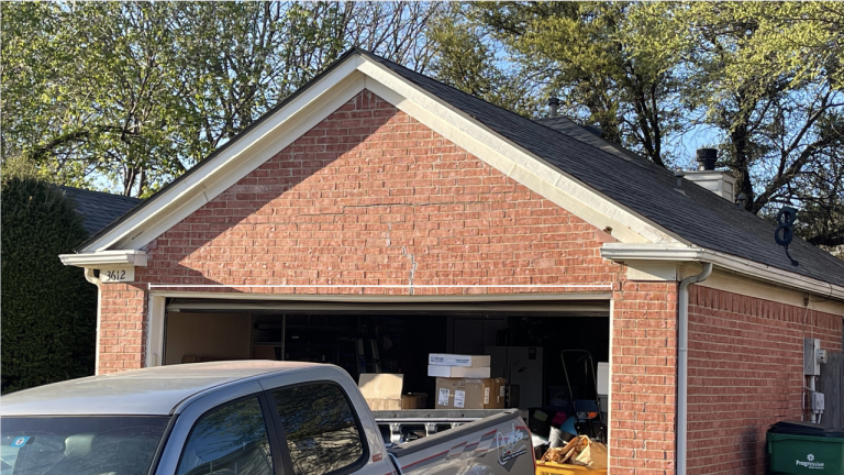Steel lintel above garage door opening